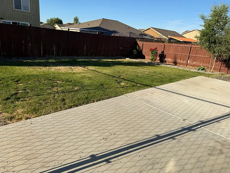 Large backyard patio great for entertaining.