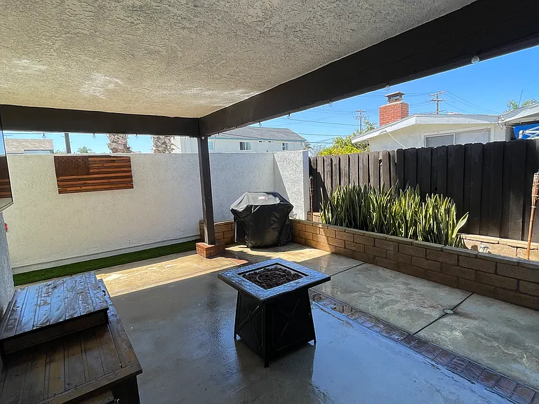 Partially covered patio, perfect for summer barbecues and entertaining guest.