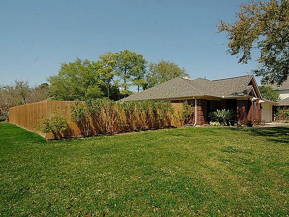 The corner homesite has a spacious front and side yard space. Wonderfully fenced for privacy.