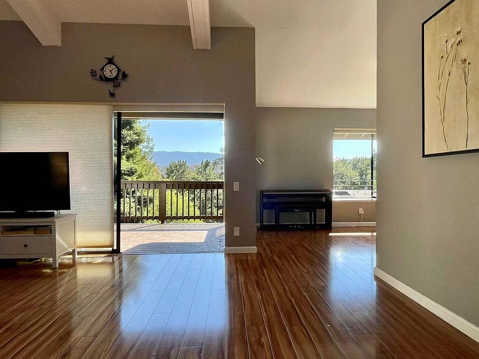 Enjoy the view from the living room and the dining room. (The other half blinds can also be opened).
