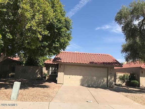 Sandia Street Approach to garage. Master bedroom to Left side and House Entrance Gate to Right side