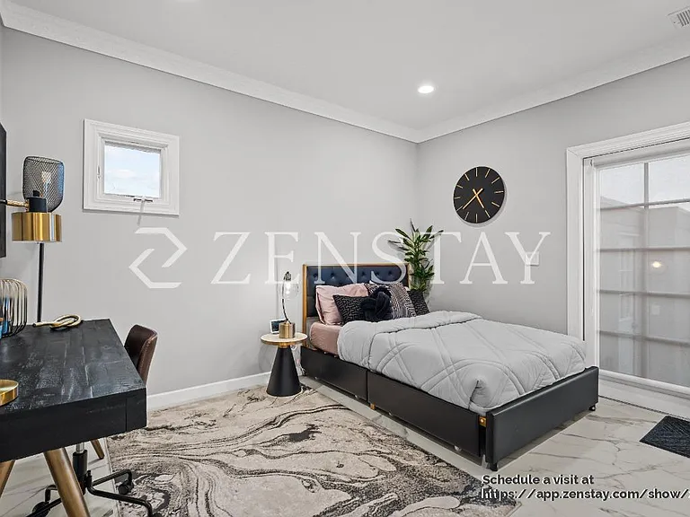 Bedroom with full bed and terrace