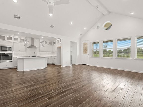 Great room dining area with soaring vaulted ceiling