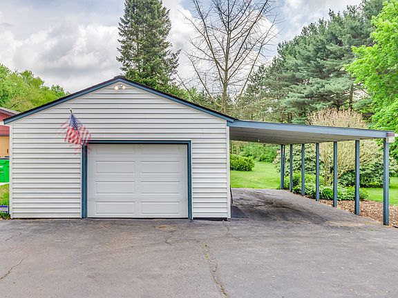 Oversized garage w/carport