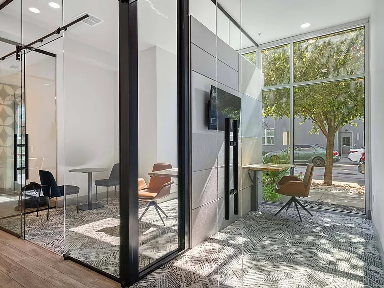 Boost your productivity in a spacious workspace with huge windows, filling the room with natural light and a refreshing atmosphere.