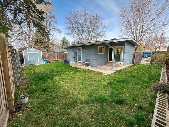 Backyard with a shed for extra storage. Great space for a dog!