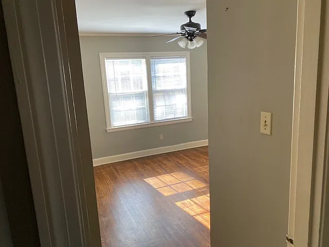 Bedroom #1 comes with Hardwood Floors, Ceiling Fan and A/C window unit.