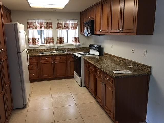 kitchen, recently remodel with cabinetry and granite counter