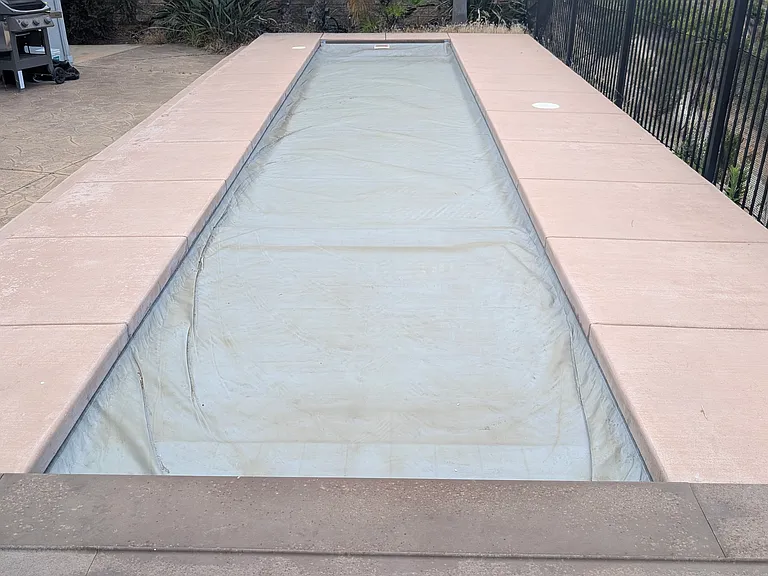 Automatic pool cover in place