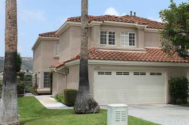 Your new home has grass and trees with a full driveway - it