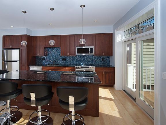 Kitchen, island, doors to balcony, custom leaded glass leading to balcony