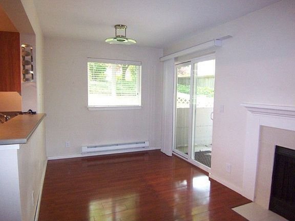 Open dining room w/slider to patio & private fenced yard. Strategically placed windows to capture da