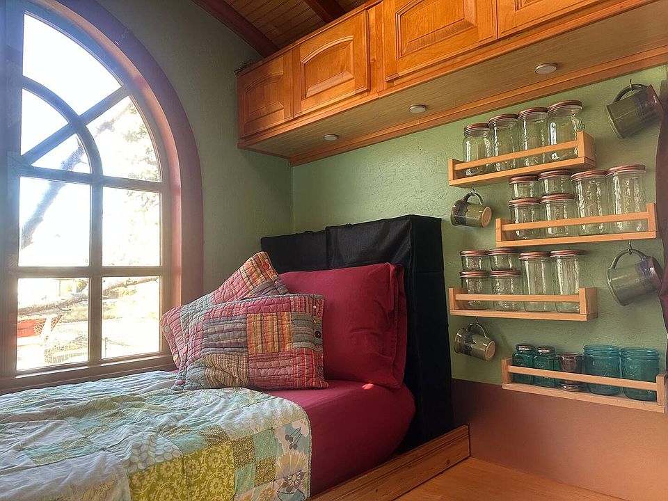 Snuggle up on the cozy window seat with a mug of tea to scout for herons in the creek behind the house!