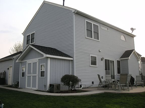 Fanced Back Yard With large shed