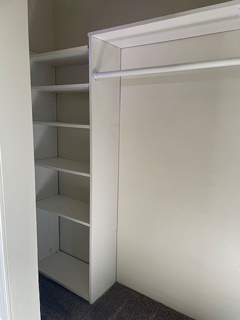 Closet with shelves and plenty of space to hang clothes