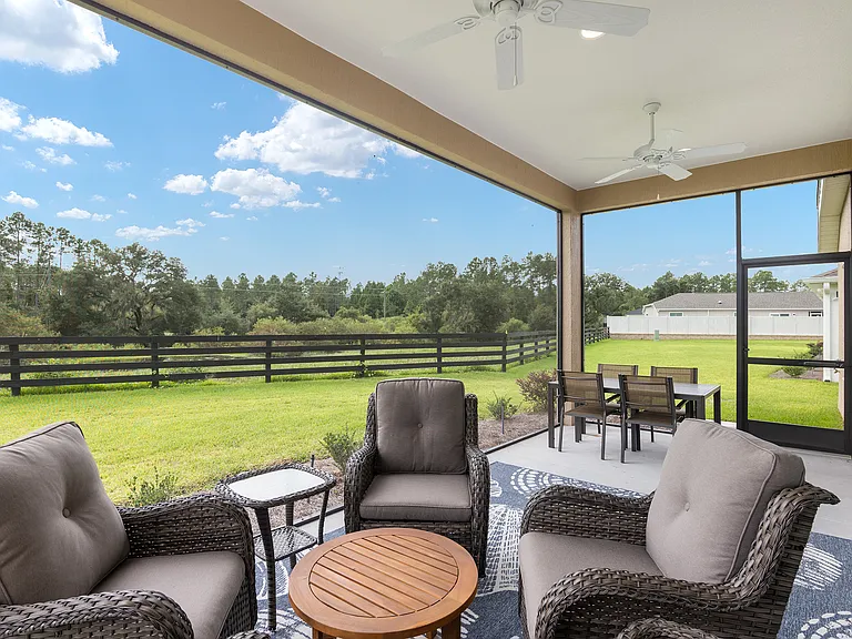 Screened in lanai with view of conservancy