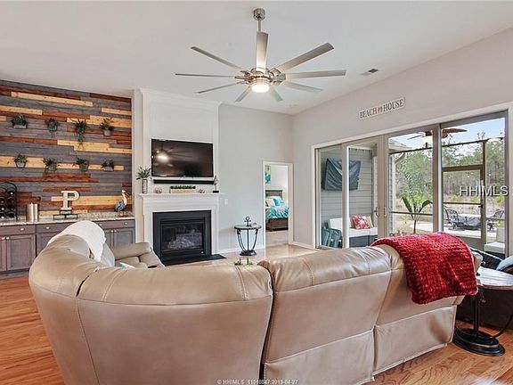 Living area leading onto the covered screened in porch
