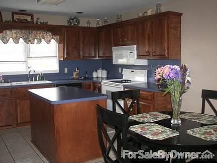 Huge Island- tile floors custom cabinets