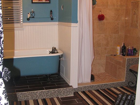 Polished travertine tile in shower