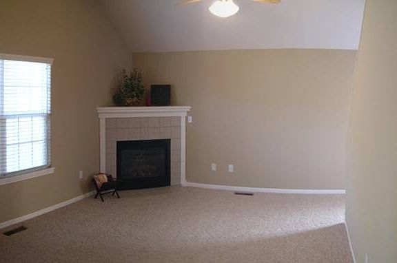 Main level living room with gas fireplace.