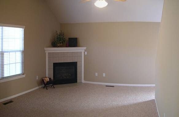 Main level living room with gas fireplace.