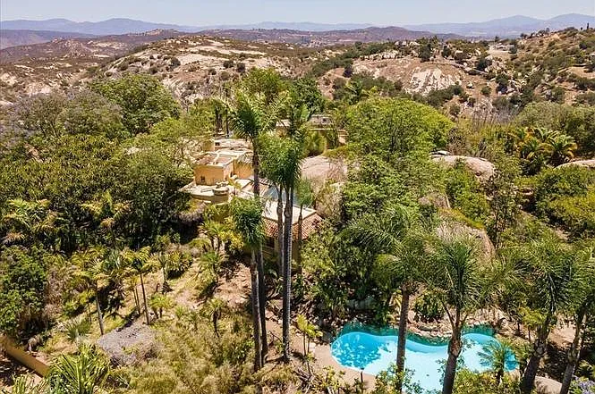 Birdseye view of the house with the main swimming pool below.