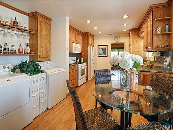 Large Kitchen with Oak Hardwood Flooring and Granite Countertops