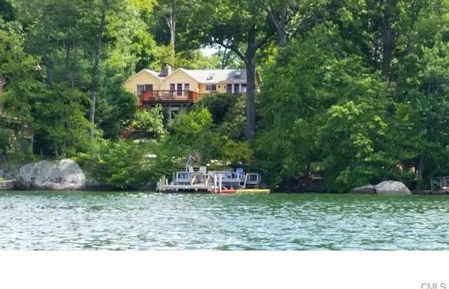One of a kind waterfront setting full privacy and level frontage with deep water dock and sandy beac