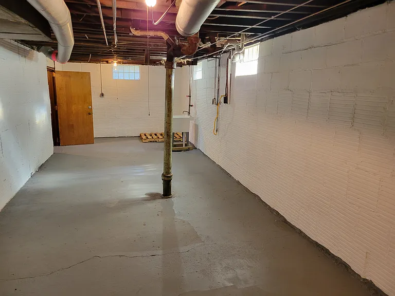 Basement leading to rear common hallway with lockable door.