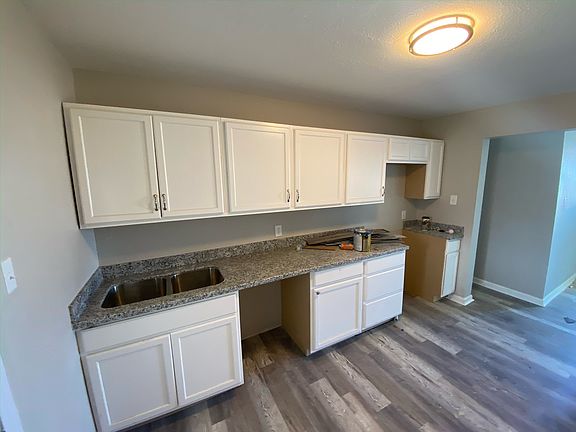 Dishwasher and range included (not pictured).