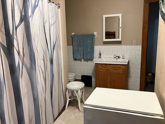 Bathroom w/shower + tub. Walk in closet not pictured