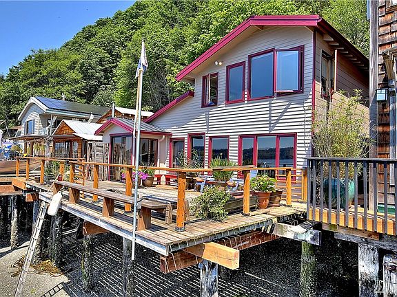 Waterfront Property!! Breathtaking panorama views of The Narrows Bridge, Olympic Mtns & Gig Harbor. SW exposure with gorgeous sunsets and marine activity right at your door. Interior and exterior were  professionally painted in June.