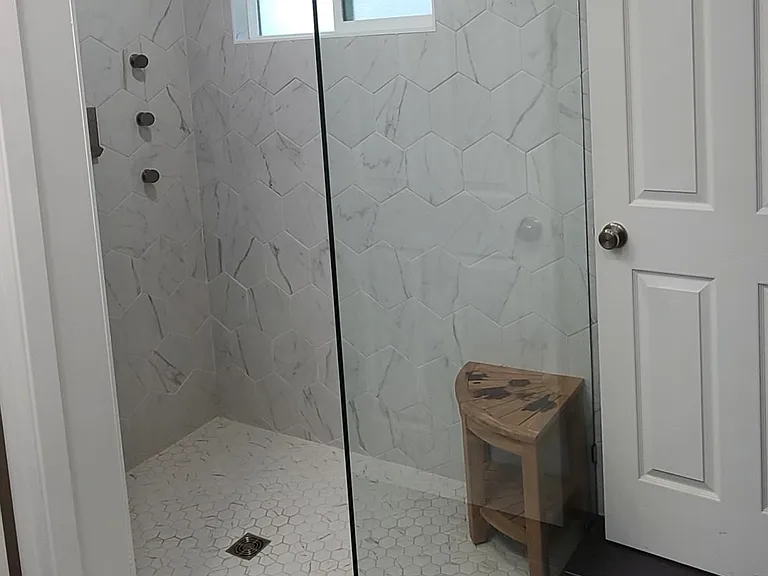 Huge curbless walk-in shower with a window (Master)