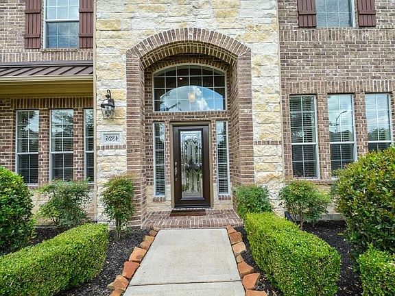 Stone elevation at the front porch. The front door was replaced new in 2016. There is a security camera at the front and back doors.