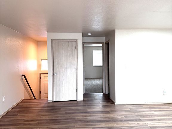 Living room, front entry stair, coat closet, entry into master bedroom and bathroom