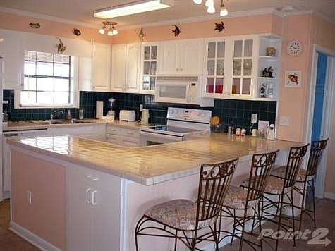 Complete kitchen area with counter seating