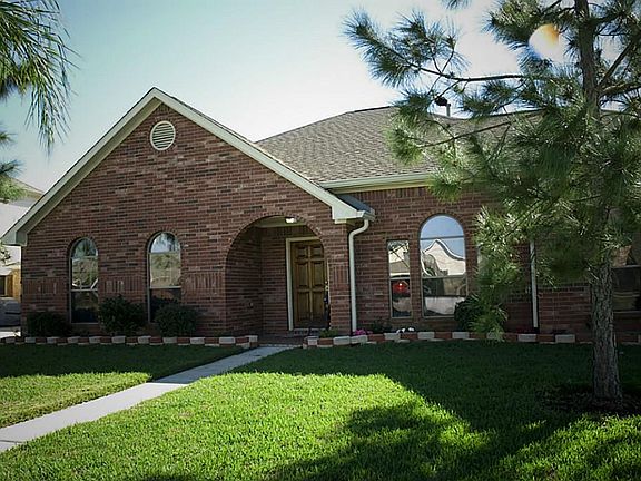 The front boasts curb appeal and a charming covered entry.
