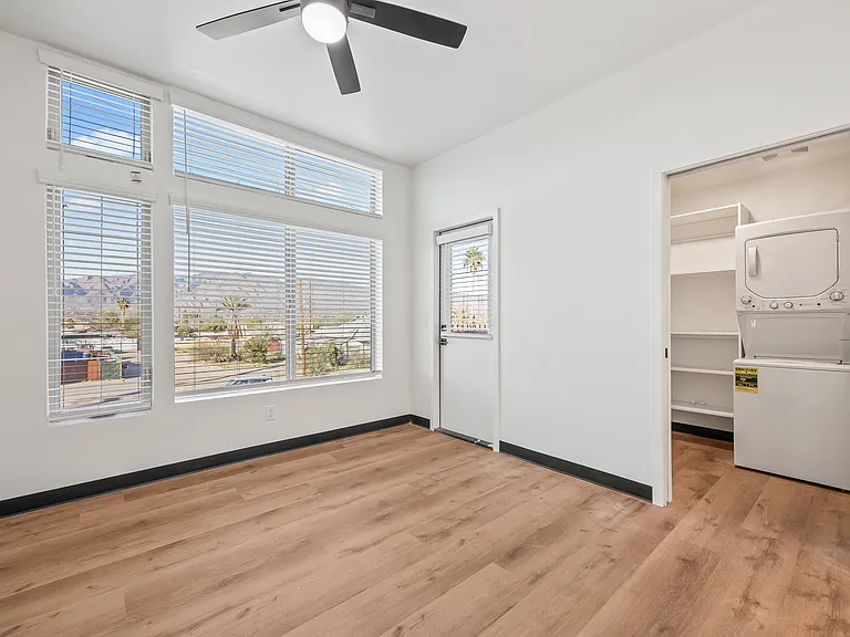 Primary bedroom with walk-in closet and W/D
