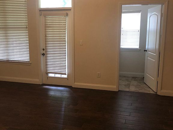 Living Room Looking Toward Laundry Room and Door to Lanai