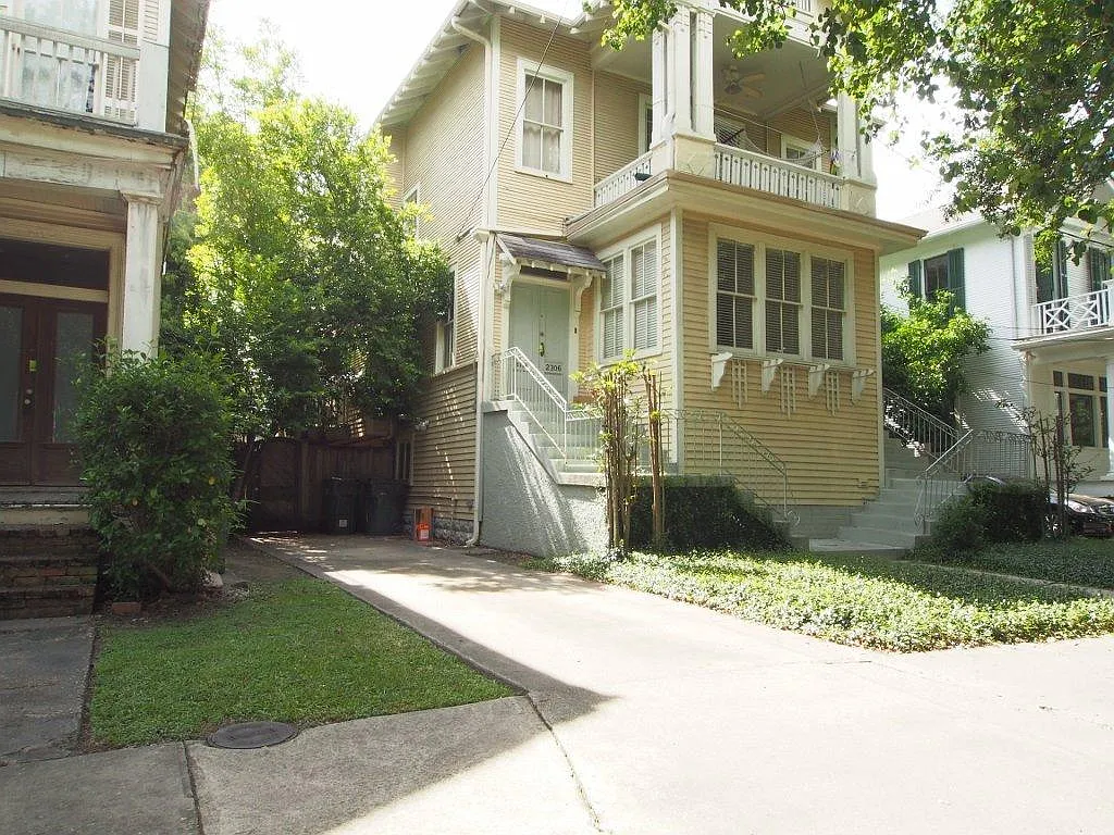 Facade, driveway, gate to fenced yard - 2308 Octavia St