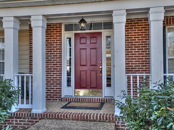 Covered front porch surro