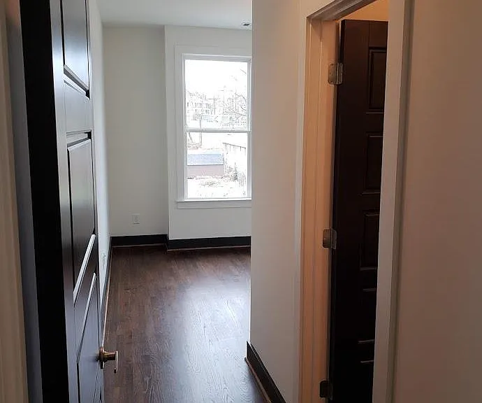 Doorway to upstairs front bedroom and bathroom.