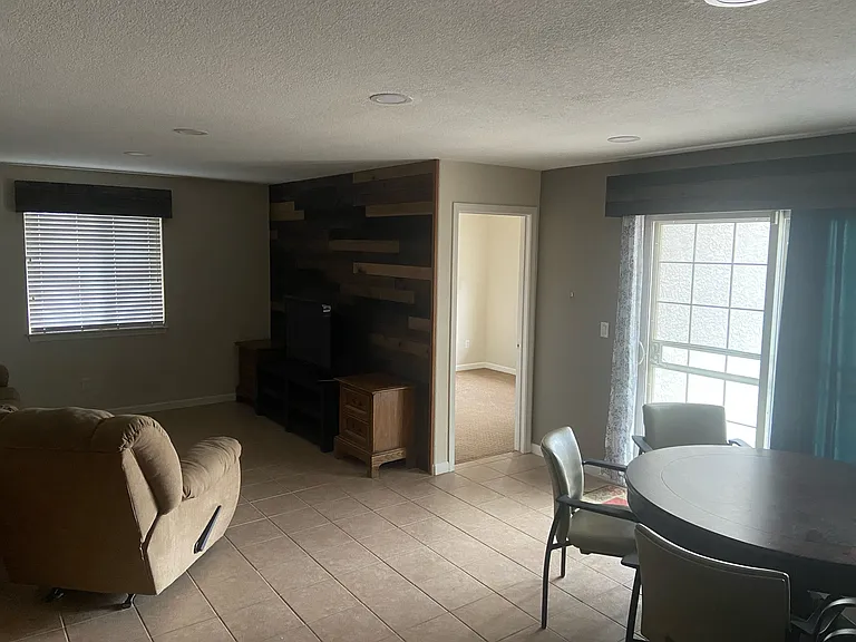 View of room from bottom of the stairs. The den is in-between the room for rent and the other downstairs roommate.