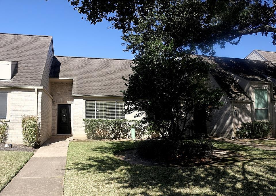 The front of the townhome faces W Little York and features mature, well-maintained yard. The HOA takes care of front yard landscaping and maintenance.