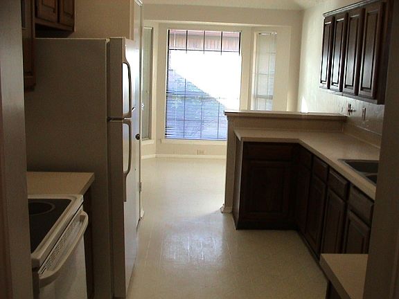 Spacious Kitchen Opens To Breakfast Room Overlooking Patio !