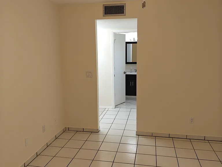1st floor bedroom access to dressing room, walk-in closet, and 1st floor bath