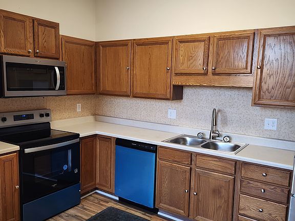 New electric range, microwave, dishwasher and refrigerator