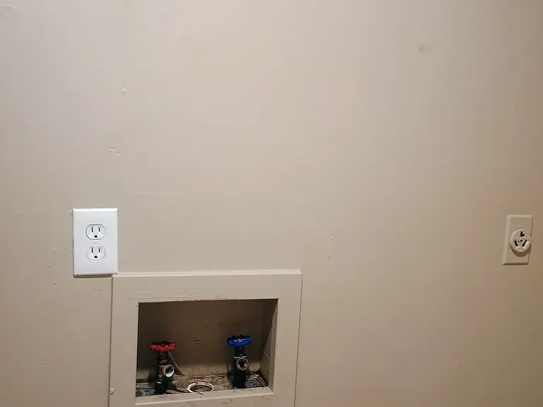 Utility room in the unit with washer dryer hook ups