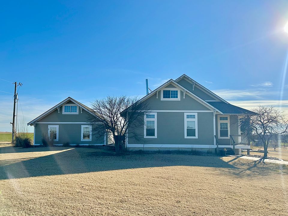 Exterior Front View- House and Garage