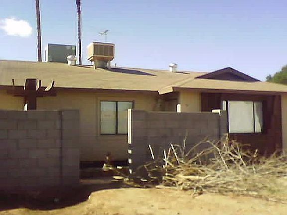 front door and entrance to side yard